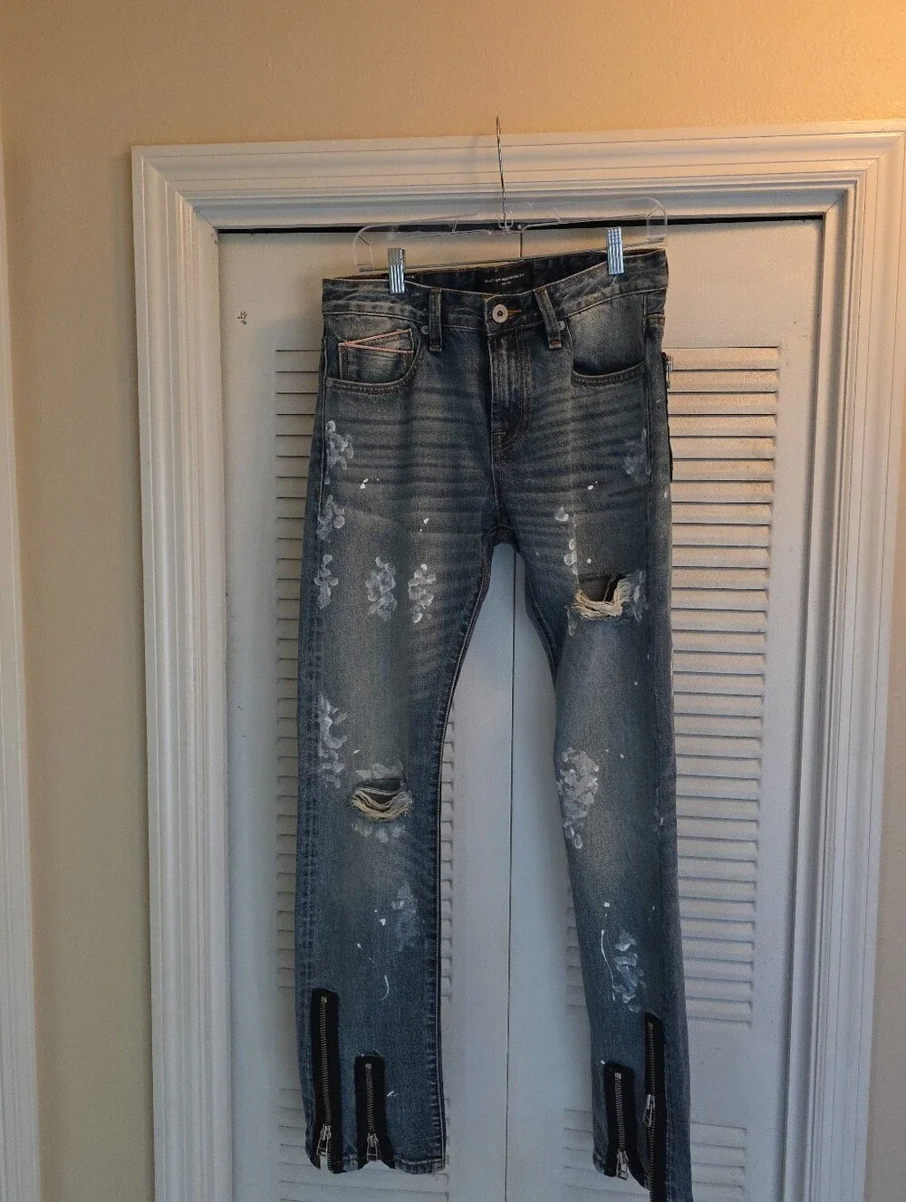 Cult of Individuality Distressed Skinny Jeans in Faded Blue with Zipper Cuffs
